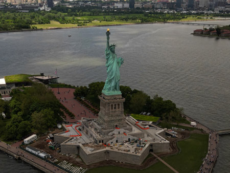 The Statue of Liberty over the Panorama of New York cityscape. New York city skyline with statue of liberty. The statue of Liberty and Manhattan. Symbol of USA. NYC.の写真素材
