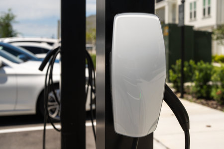 Electric car charging. Charging station to recharge battery with electricity by EV charger cable. EV Charging Station, Clean energy. Charging an electric car. Electric cars.の写真素材