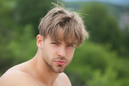 Beauty sexy male model. Handsome man with topless sexy body. Muscular model. Strong brutal guy. Portrait of handsome sexy model. Handsome young guy with naked body, bare torso. Sexy male model.の写真素材