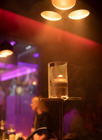 Smoking hookah. Hookah smoke nightlife. Nightclub hookah lounge. Luxury nightclub. Hookah lounge atmosphere.の写真素材