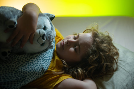 Child sleeping in a bed. Cute kid sleep. Kids pillow and blanket for sleeping. Little boy sleeps....