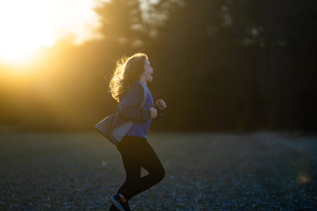 Sport kids. Child running. Kids jogging in the park. Child enjoying a run. Teen runner in motion....