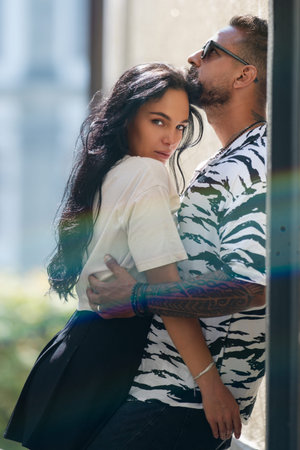 Romantic couple in love hugging in street. Smile, romance couple embracing for sweet moment together outdoor. Romantic Couple kissing on city street. People on romantic date. Romantic Couple in love.の写真素材