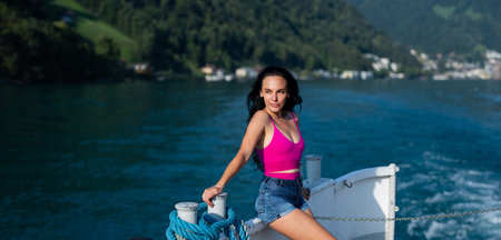 Beauty woman on summer vacation. Boat ride in paradise resort. Summer travel on lake. Carefree on a...