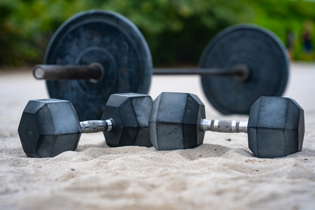 Sports equipment. Kettlebell, barbell and dumbbells for summer sport. Outdoor sport. Fitness workout in public sport gym. Lifting weights. Healthy lifestyle. Fitness outdoors. Sport background.の写真素材