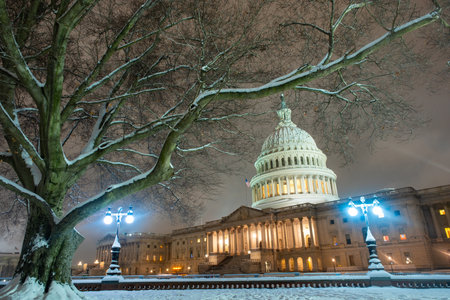 USA Capitol in winter. Congress. American Capitol Building in snow. Washington city Capitol. United States Capital. Washington, USA landmark. Supreme Court. Washington D.C. monument. Washington city.の写真素材