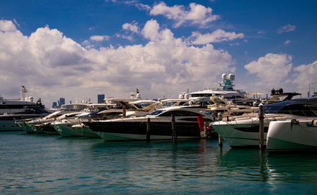 Yacht sailing on sea waters. Luxury superyacht at sea. Miami Beach with yachts. Tropical seascape...