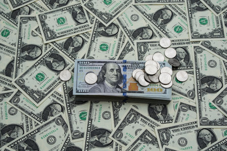 Background of US dollars. Money and coins on table. Cash money concept. Dollar bills background. American currency. Banknotes and Dollars bills. Money exchange idea. Crisis for US dollars.の写真素材