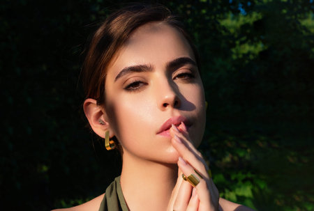 Close-up portrait of young beautiful woman. Portrait of elegant model. Beauty woman. Stylish sensual woman. Young lady. Nature woman face. Portrait of hispanic girl.の写真素材