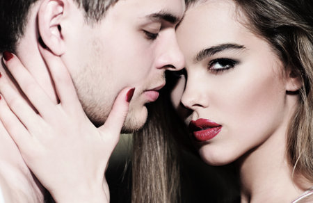 Couple in love. Sensual lovers portrait close-up. Sensual woman and man embracing. Sexy couples portrait. Sexy couple in love. Lovers hugging. Tender couple. Couple sensual touch.の写真素材