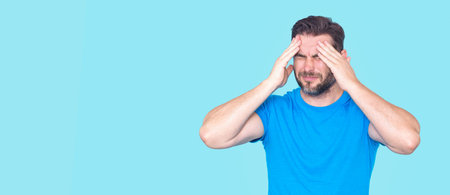 Worried Man with expression of anxiety. Worried Man experiencing mental health issues, worry, frustration, and emotional stress. Worried man feeling stress. Worried expression.の写真素材