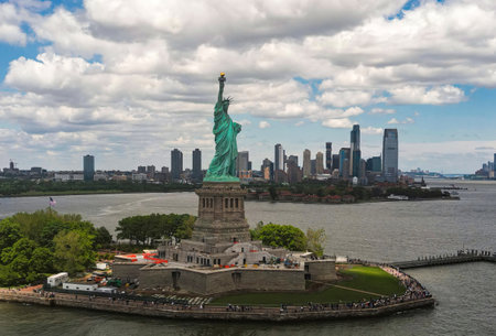 New York City with statue of liberty photo from drone. Aerial view of statue of liberty skyline in Manhattan. NYC, NY. Cityscape near statue of liberty. Famous statue of liberty of New York.の写真素材