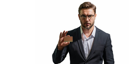 Handsome man holding credit card. Middle aged man in suit with credit card isolated on white studio...