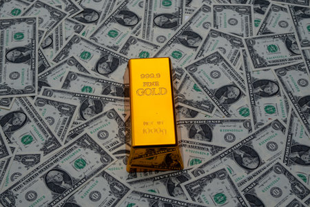 Gold bars. Dollar bills with gold bars. Cash money. Finance and banking concept. Golden bullion. Hundred dollar bills and Gold bars. Treasure chest with currency. Earning money in Gold.の写真素材