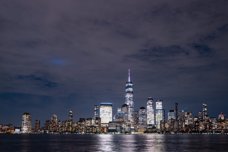 Manhattan skyscrapers at night. NY cityscape with lights. Night in New York. NYC night cityscape....