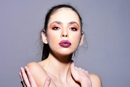 Fashion makeup, natural beauty. Eyeliner and vibrant lips. Makeup eyeshadow with fashion effect....