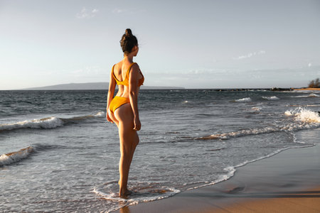 Woman enjoys her tropical beach vacation. Concept of wellness and travel.の写真素材