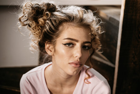 Beautiful girl smiling with red curly hair. Girl with shiny curly hair. Beautiful model woman with wavy hairstyle.の写真素材