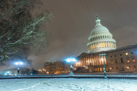 USA Capitol in winter. Congress. American Capitol Building in snow. Washington city Capitol. United States Capital. Washington, US landmark. Supreme Court. Washington D.C. monument. Washington city.の写真素材