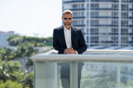 Business man standing confidently. Successful business man . Executive in suit. Handsome business...
