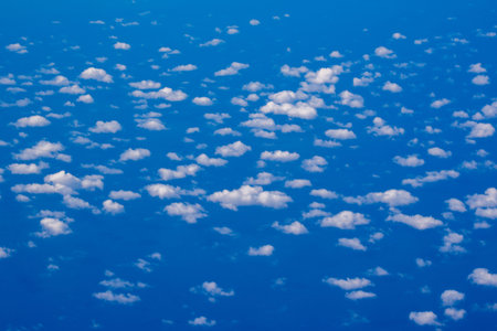 Dreamy cloudscape above. Sky with white clouds. Sky background design. Full clouds. Puffy cumulus...