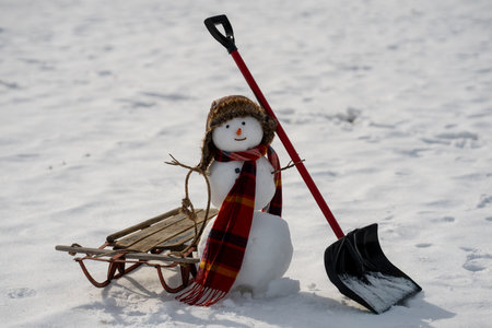 Snowman winter background. Snow holiday scene. Festive snowman with scarf. Snowy design. Happy snow-man with hat. Christmas banner. Frosty snowman. Winter greeting postcard. Funny snowman.の写真素材