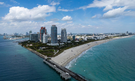 Miami Beach on blue sky. Skyline aerial view. Miami city. Tropical Miami scene. Miami district sky view. Famous oceanfront. Panoramic coastline. South beach panorama view. Summer holiday vibes.の写真素材