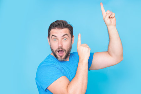 Portrait of excited caucasian man with amazed expression, excited face. Emotion people. Excited man doing winner gesture, smiling and screaming for success. Winning successful and celebrating victory.の写真素材
