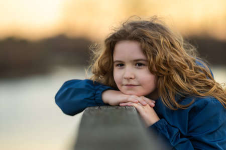 Kids face close-up. Blonde kid dreams. Teen face. Child imagination face. Little thinker on carefree day. Happy kid portrait. Dreams in a child eyes. Quiet moment of childhood imagination. Child face.の写真素材