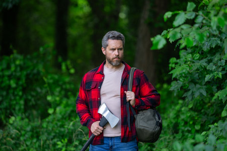 Men power. Lumberjack. Logging and chopping concept. Lumberjack worker in the forest. Lumberjack in...