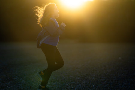 Kid running. Kids jogging in the park. Kid enjoying a run. Teen runner in motion. Child sprinting...