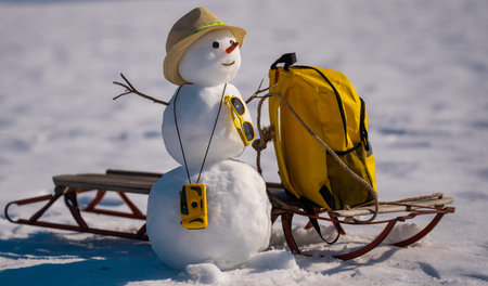 Winter gift from Snowman. Winter sale concept. Christmas and New Year celebration. Winter holiday scene. Winter delivery service. Tourism and preparing for travel.の写真素材