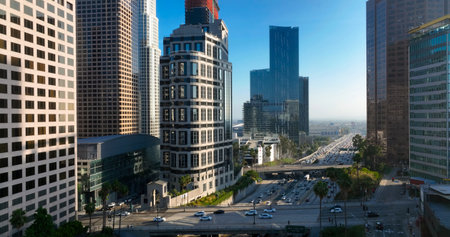 Los Angeles city. LA downtown aerial view. Los Angeles skyline. LA streets. Los Angeles from a top view. Downtown towers of Los Angeles. Panoramic scene of LA skyline. Blue sky frames the city below.の写真素材
