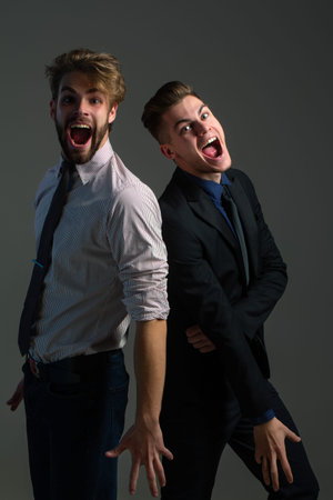 Man models posing in studio. Man couple in fashion style. Stylish guys pride. Handsome boyfriends in elegant outfit. Trendy male models. Fashion men posing. Stylish gay couple. Fashion man.の写真素材