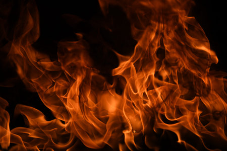 Fire blaze flames on black background. Fire burn flame isolated, abstract texture. Flaming explosion...