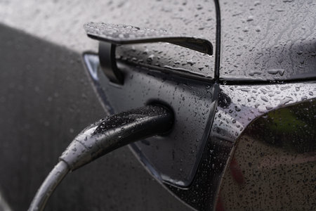 Electric car charger. Plug for vehicle with electric engine. EV charger. Clean energy. Charging...