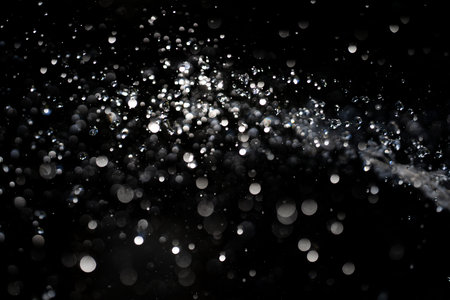 Water drops splash on black background. Splashing in motion. Water splash design. Splash with...