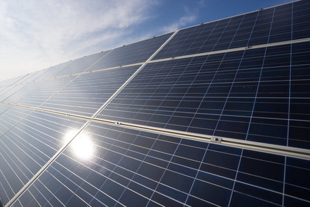 Panel installation on rooftops. Solar solutions for green living. Power from solar is renewable. Solar panel and sun energy. Solar fields generate clean energy.の写真素材