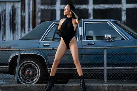 Sexy Girl posing near luxury american retro car outdoor. Sexy sensual women and fashion concept. Fashion sexy model posing near retro car outdoor. Sexy glamour trendy fashion woman. Beauty trends.の写真素材