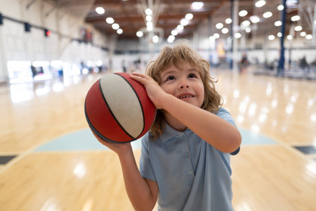 Sport kid. Child playing basketball. Child hold basketball ball.の写真素材