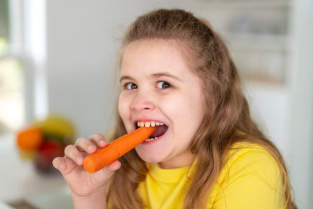 Kid eating healthy breakfast at home. Kid enjoying fresh fruits at the dining table.の写真素材