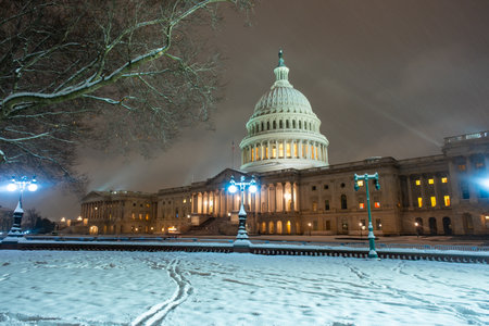 USA Capitol in winter. Congress. American Capitol Building in snow. Washington city Capitol. United States Capital. Washington, US landmark. Supreme Court. Washington D.C. monument. Washington city.の写真素材