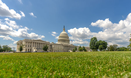 Washington DC Capitol dome. Congress and Senate Capitol building. USA flag over Capitol dome. Election day in Washington. American Capitol. Congress and Senate in USA.の写真素材