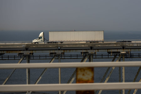 Truck on the road. Lorry transporting. Cargo trailer. Logistics truck, international shipment. Truck...