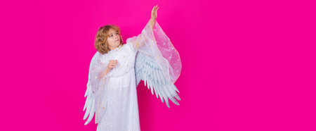 Banner. Little cupid angel child with wings. Studio portrait of angelic kid.