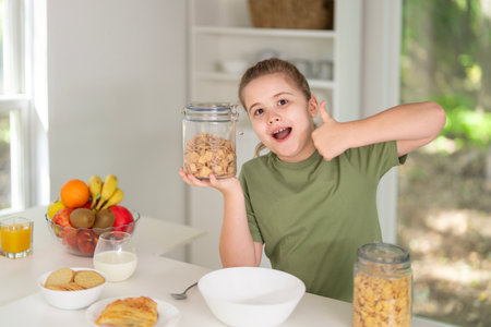 Child eating healthy food at home. Child enjoying fresh fruits and vegetables. Happy child having healthy breakfast. Cute child eating tasty vegetarian healthy meal. Healthy organic food for kids.の写真素材