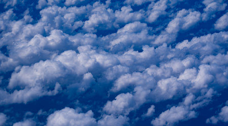 Blue sky with calm clouds background. Bright blue sky background. Cloudscape with white clouds. Calm...