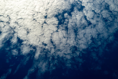 Blue sky with fluffy clouds background. Bright blue sky background. Cloudscape with white clouds....