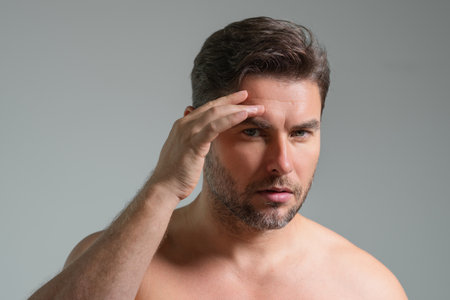 Mens beauty. Cream treatment for mens face. Beauty routine. Face of a beauty man with perfect skin....