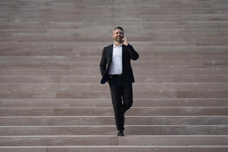 Businessman walking up stairs as a symbol of career growth and success. Business step. Future goal...